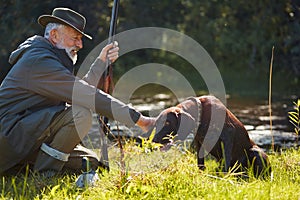 Affectionate senior hunter with dog