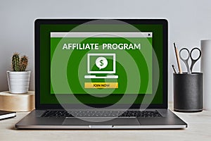 Affiliate program concept on laptop screen on modern desk