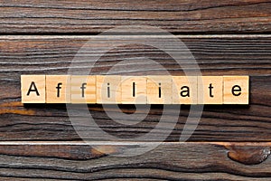 AFFILIATE word written on wood block. AFFILIATE text on wooden table for your desing, concept