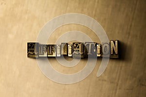 AFFILIATION - close-up of grungy vintage typeset word on metal backdrop photo