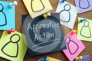 Affirmative action concept. Memo stick pinned to the board.