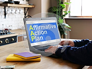 Affirmative Action Plan AAP is shown on the business photo using the text