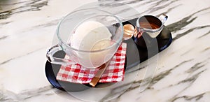 Affogato coffee dessert, Cup of vanilla ice cream with stainless mug of espresso shot