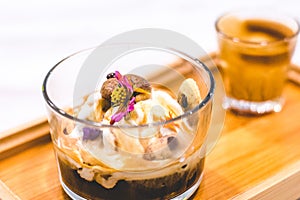 Affogato with expresso and vanilla ice cream and edible flowers