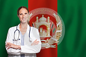 Afgan general practitioner doctor gp on the flag of Afganistan photo