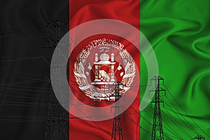 Afganistan flag in the background Conceptual illustration and silhouette of a high voltage power line in the foreground a symbol photo