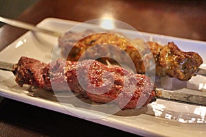 Afghan cuisine: mutton kabob and murgh (Afghan chicken)