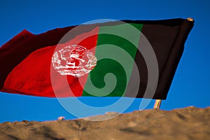 Afghan Flag in Desert Landscape