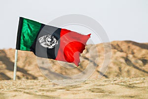 Afghan Flag in Desert Landscape