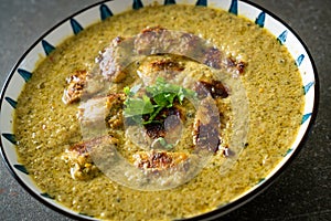 Afghani chicken in green curry or Hariyali tikka chicken hara masala