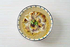 Afghani chicken in green masala curry or Hariyali tikka chicken hara masala