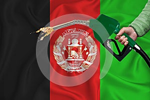 AFGHANISTAN flag Close-up shot on waving background texture with Fuel pump nozzle in hand. The concept of design solutions. 3d