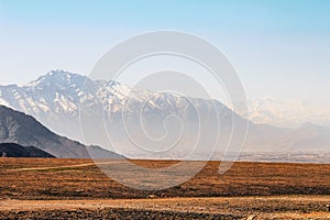 Afghanistan landscape, desert plain against the backdrop of mountains
