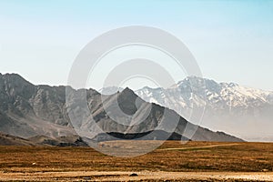 Afghanistan landscape, desert plain against the backdrop of mountains