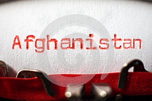 Afghanistan typed on typewriter on red