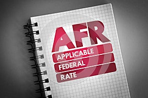 AFR - Applicable Federal Rate acronym on notepad, business concept background photo