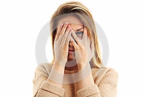 Afraid woman looking at camera on a white background
