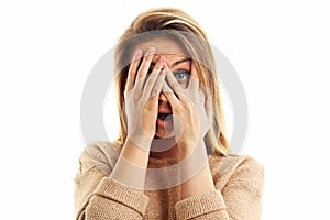 Afraid woman looking at camera on a white background