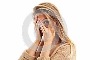 Afraid woman looking at camera on a white background