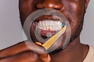 africa man toothbrush in gray background isolate