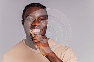 africa man toothbrush in gray background isolate