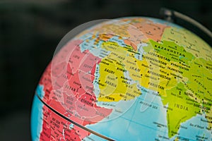 Africa, middle east and Europe map on a globe with earth map in the background.