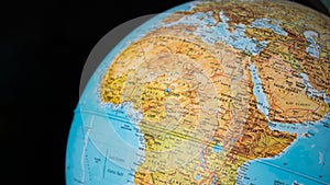 Africa and middle east map on a globe with a black background.