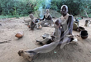 Africa, South Ethiopia.2009. Unidentified Karo mother and childern in their village in Mago National Park