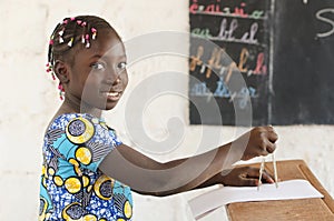 Africa and Technology - Beautiful African Girl at School with Co