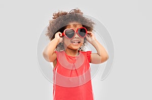 African ameican girl in heart shaped sunglasses