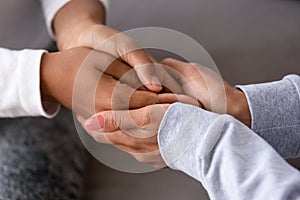 African american adult woman holding hands of child teen daughter