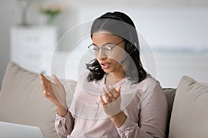 African American agent in headset consult client online