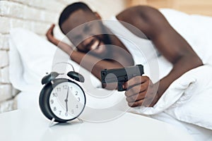 African American angry man with gun aims photo