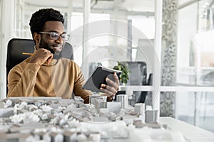 African american architect working in his office and looking busy