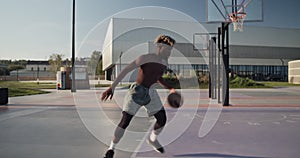 African American athlete doing freestyle basketball tricks