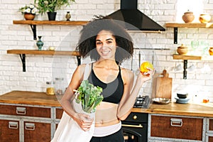 An african-american athletic girl with vegetables