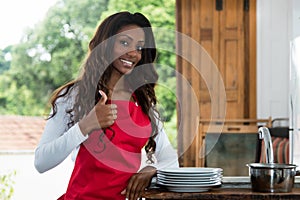 African american au pair girl at kitchen