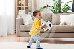 African american baby boy playing with soccer ball