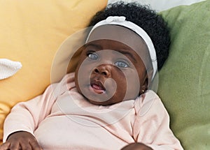 African american baby smiling confident sitting on bed at bedroom