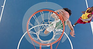 African American basketball player scores a basket