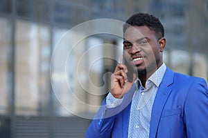 African American bearded man calls to colleague on phone