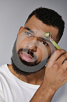 African american bearded man using face