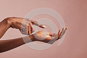 African american beauty hands with moisturizing cream on palm