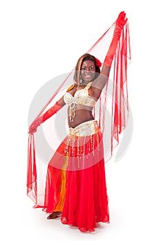 African-american belly dancer posing with veil