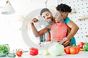 african american black couple kitchen home cooking love happy together indoor food