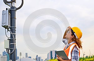 African American black female engineer was checking the readiness of a communication tower