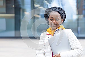 African american black female girl student remote studing, working, using laptop outdoor. back to school.