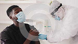 African american black man with face mask receiving vaccine against coronavirus