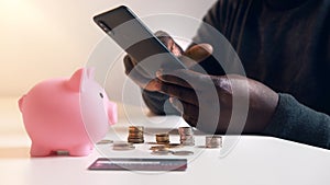 African american black man making online purchase using credit card and smartphone app