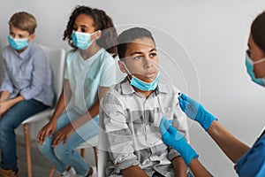 African American Boy Getting Tested For Covid-19 Antigen In Clinic